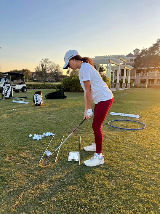 Woman golfing