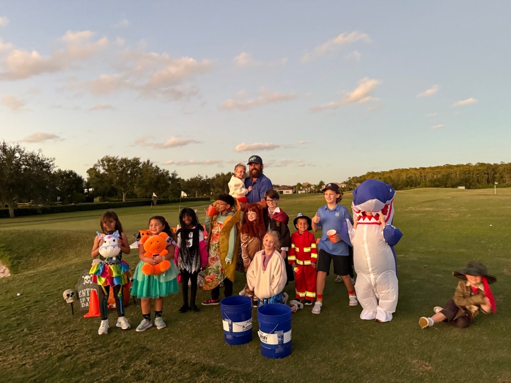Kids in Halloween costumes at the golf course